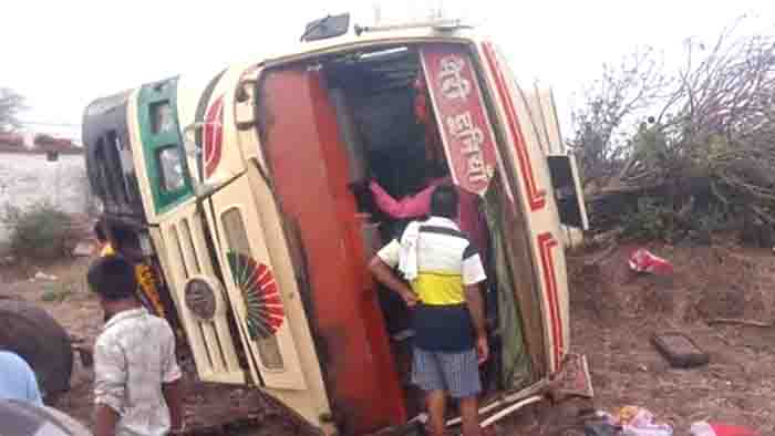 High speed bus filled with passengers over turned in the fild