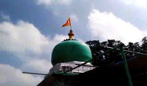 Vandalized in mazar,safforn flag hoisted in tomb dome
