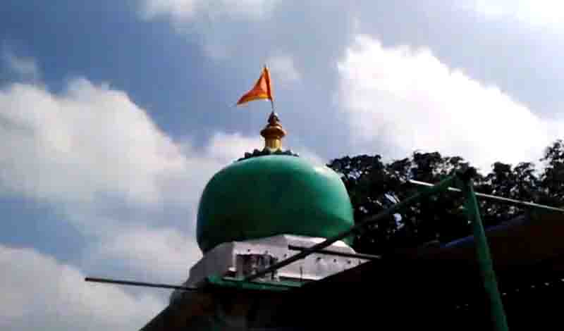 Vandalized in mazar,safforn flag hoisted in tomb dome